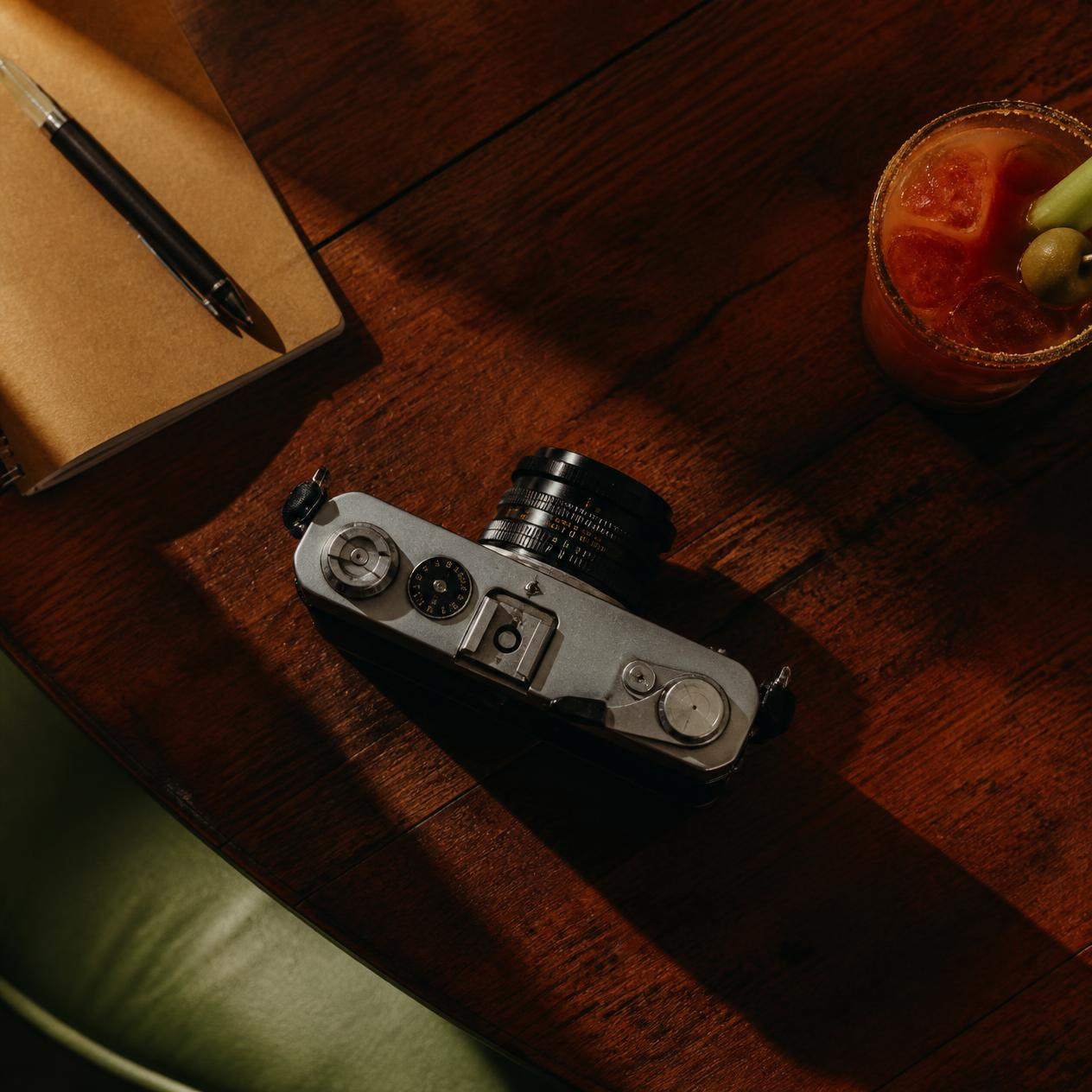Woman speaking on a vintage olive rotary telephone